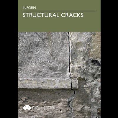 A large crack running down a stone building