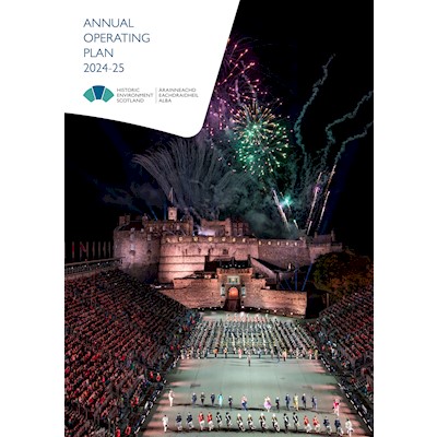 Front cover of the annual operating plan, an aerial view of Edinburgh Castle in the dark during the Edinburgh Military Tattoo and fireworks going off