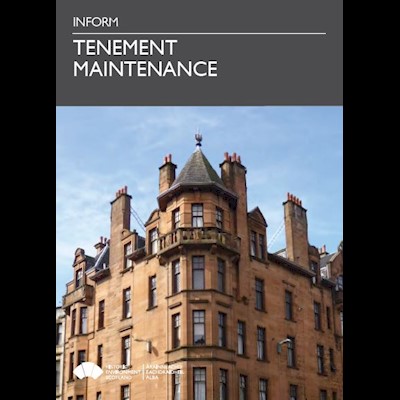 A cover photo featuring a block of tenements