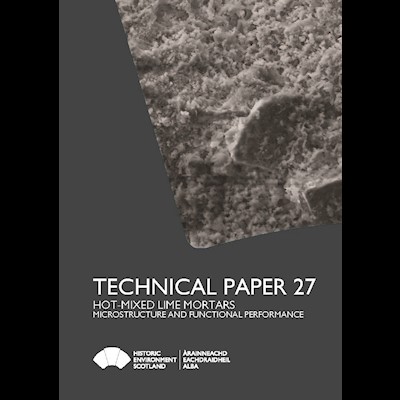 A graphic of a grey book cover with a picture showing microporous nature of lime mortar