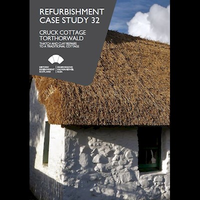 Cover page featuring a thatched cottage with white painted stone walls