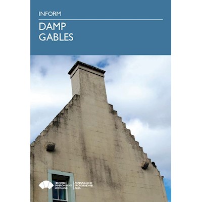 A blue cover page featuring a photo of the gable end of a traditional building with a chimney