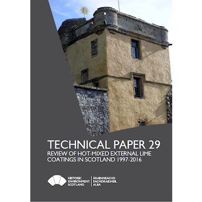 Paper cover featuring a photo of a building coated in lime