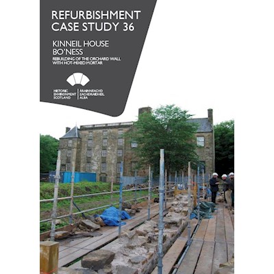 A cover page with an image of repair works in a garden outside a large, historic building